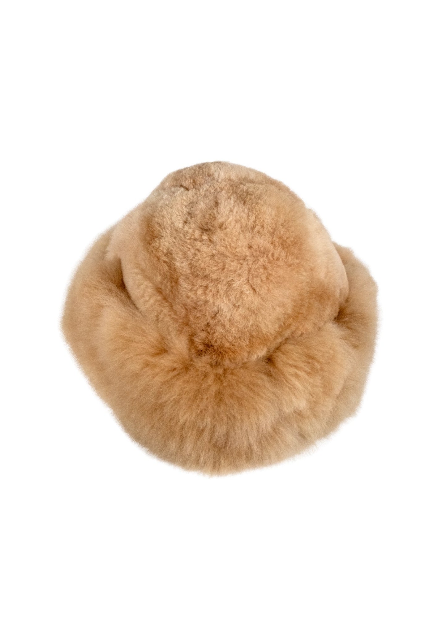 A single fluffy real alpaca fur cap in a warm medium beige color, photographed on a clean white background.
