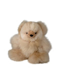 A fluffy cream-colored teddy bear plush toy made of a soft alpca fur, small black eyes, and a stitched brown nose, shown against a plain white background.