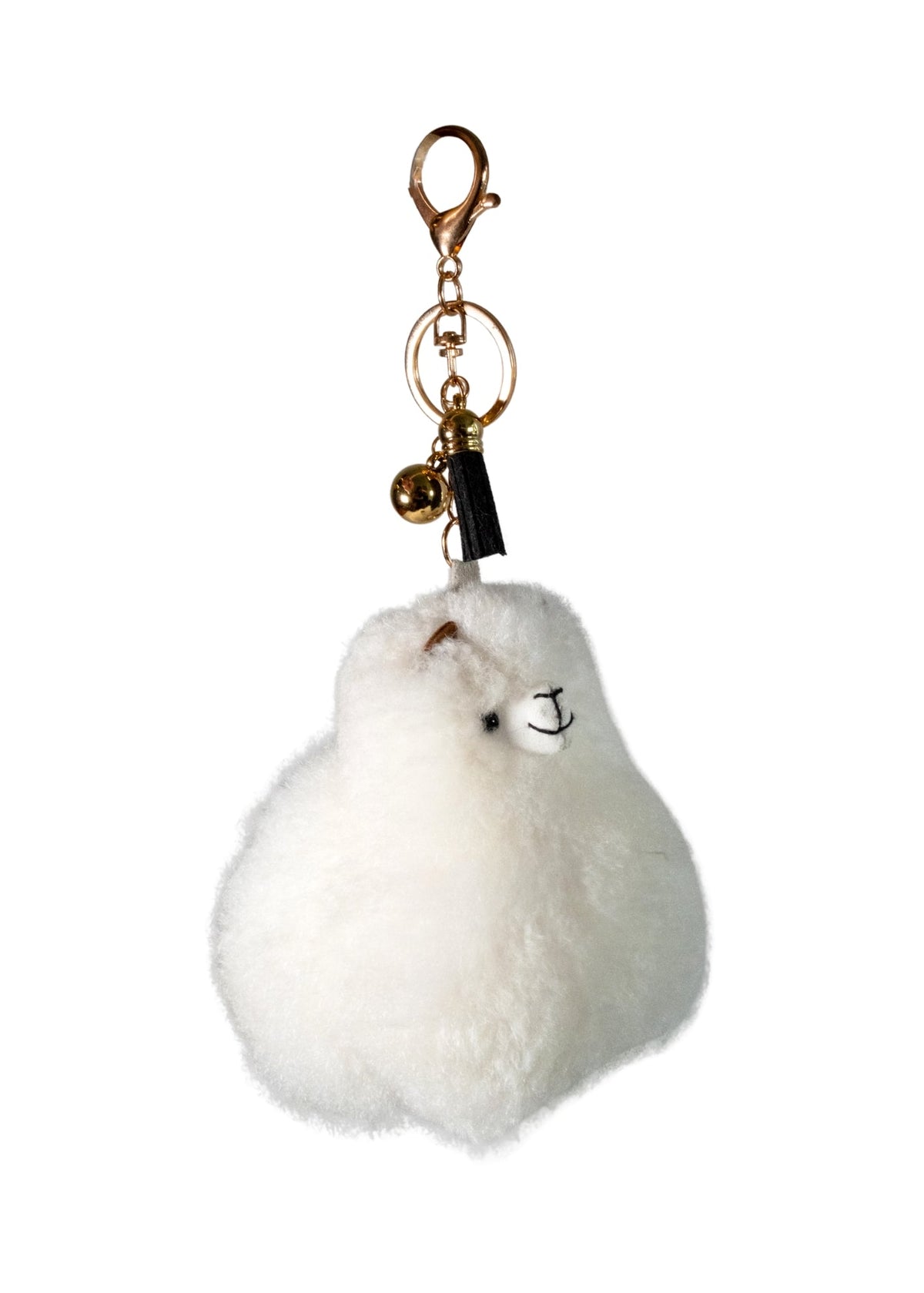 A fluffy white alpaca keychain charm with a small embroidered face, black tassel, and gold-tone clasp and bell, shown on a plain white background.